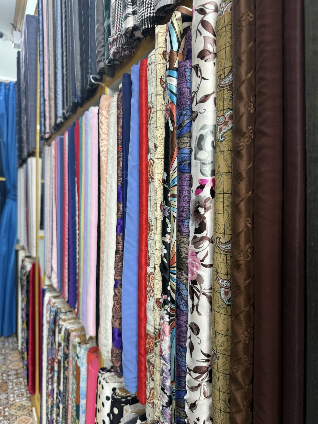 Shelves of silks and printed fabrics
